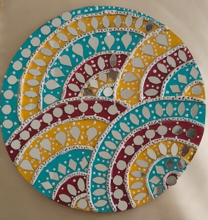 Colorful decorative plates with intricate patterns and metallic accents.